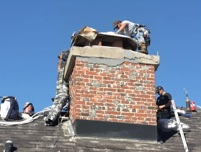 Kent Chimney Sweep installing a custom chimney crown in Kent, OH