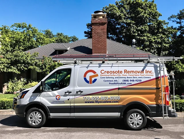Kent Chimney Sweep technician removing creosote safely in Kent, OH