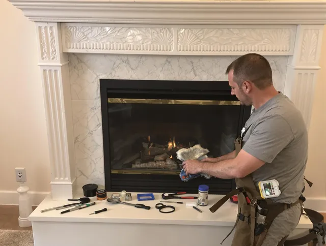 Kent Chimney Sweep performing fireplace maintenance in Kent, OH