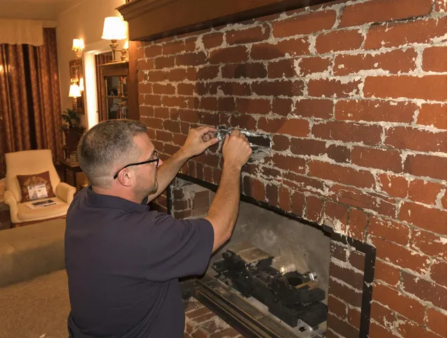 Kent Chimney Sweep expert fixing a fireplace in Kent, OH